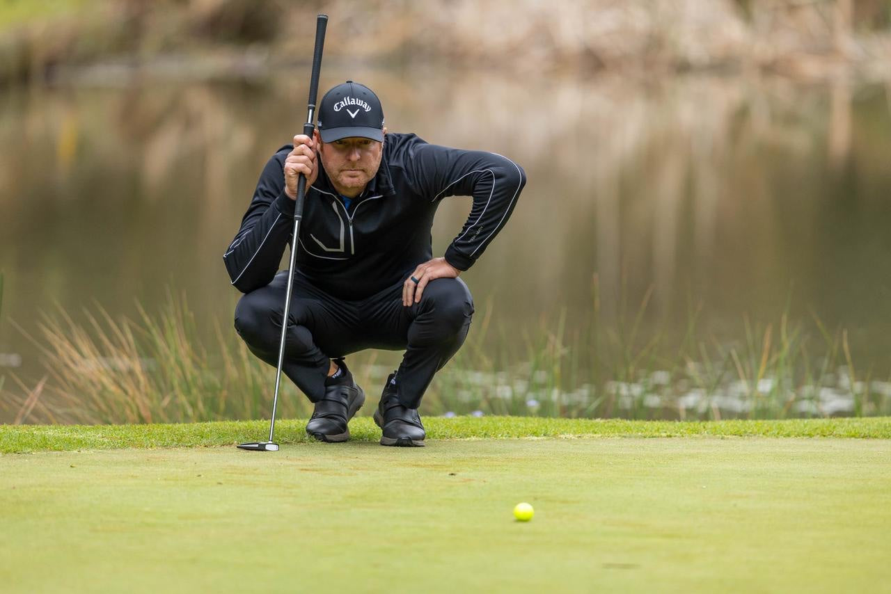 Jacques Blaauw reading a putt on the golf course