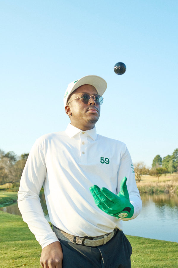 Msizi James wearing 59 golf apparel on the golf course