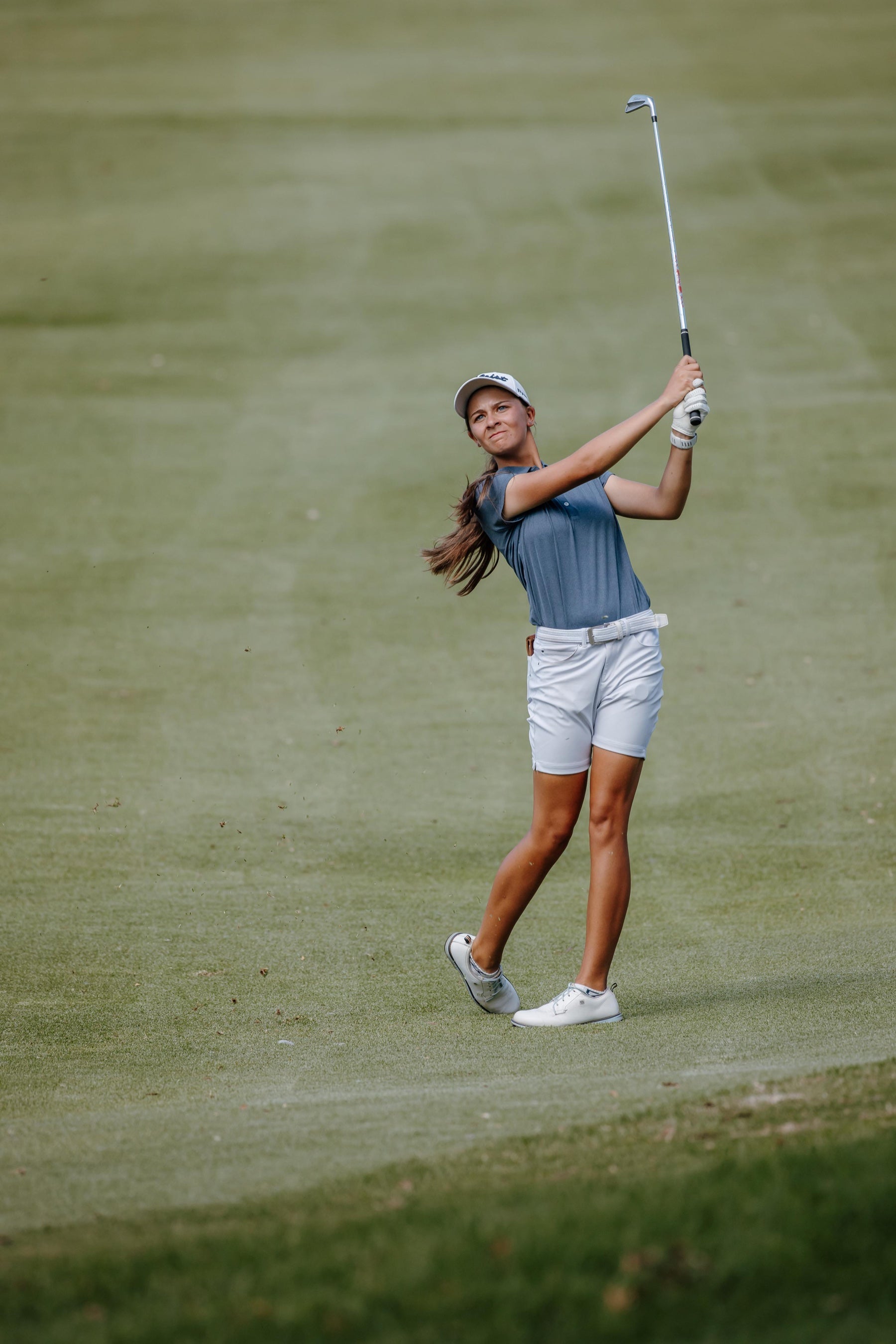 Zané Kleynhans following through on a golf shot
